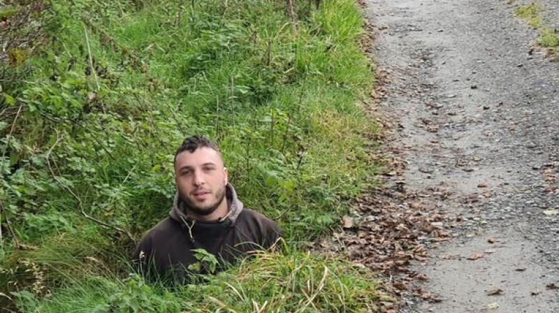 Fed-up motorist got his son to stand in pothole to show how huge it is Fed-up motorist got his son to stand in pothole to show how huge it is