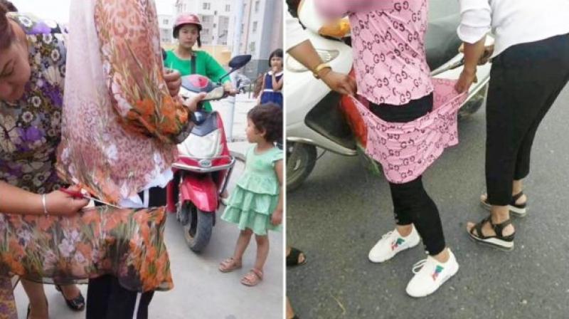 China Police Cutting Long Clothes Muslim Women