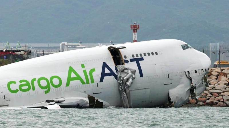 cargo plane skids off runway into sea at Hong Kong International Airport cargo plane skids off runway into sea at Hong Kong International Airport