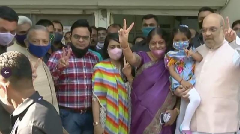 Amit Shah along with his family members casts his vote