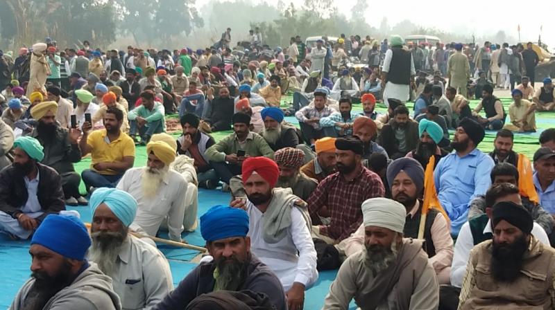 Thousands of farmers have been sitting on the road and rail track