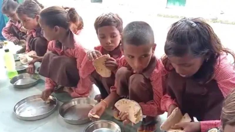UP schoolchildren seen eating roti salt under flagship nutrition scheme 