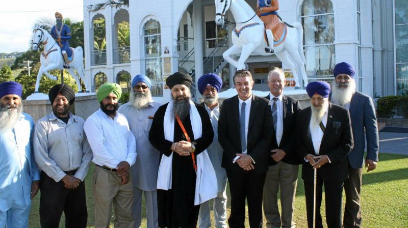 Coffs Harbour MP Andrew Fraser escorts Minister Ray Williams on a visit to Guru Nanak Sikh