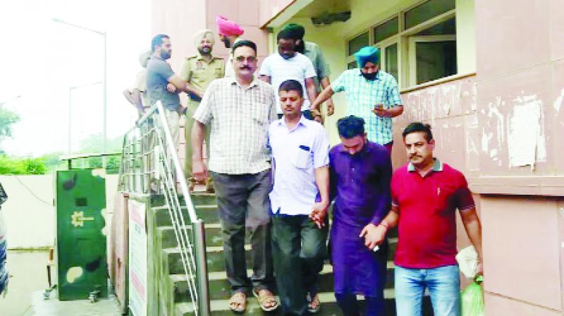 Employees carrying out the accused after the hearing Employees carrying out the accused after the hearing