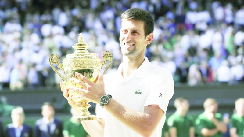 Novak Djokovic holds with winners trophy Novak Djokovic holds with winners trophy