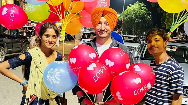 Love story: Lakshmi standing with Inderjit Nikku had to fry poodis by hand in hot oil. Love story: Lakshmi standing with Inderjit Nikku had to fry poodis by hand in hot oil.