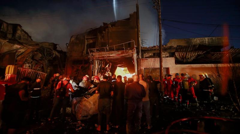 Iraq: Building collapsed due to fierce fire, dozens injured Iraq: Building collapsed due to fierce fire, dozens injured