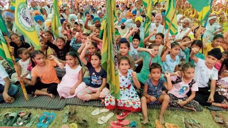 Flags of Kisan Unions in the hands of old women and children