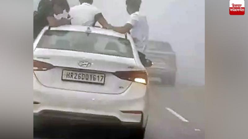 Youths perform stunts in a moving vehicle in Uttarakhand Youths perform stunts in a moving vehicle in Uttarakhand