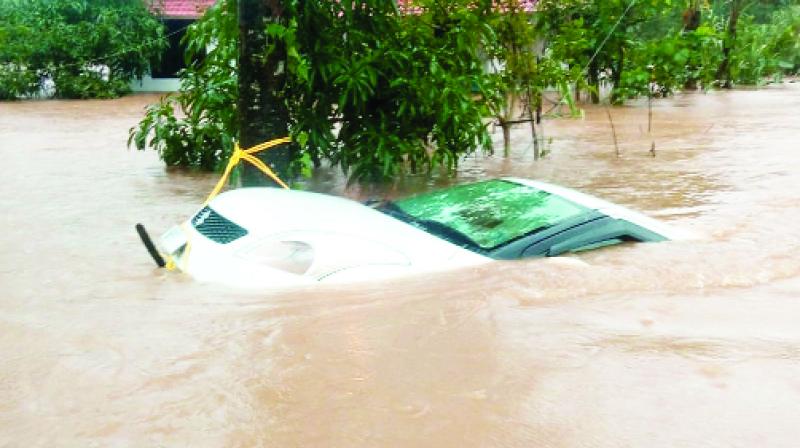 Car floating in flood waters Car floating in flood waters