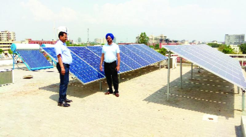 Officer giving information about the solar panels Officer giving information about the solar panels
