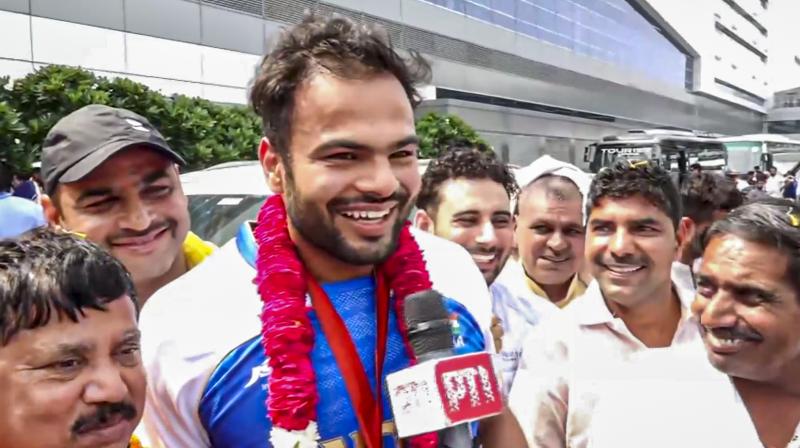 New Delhi: Paris Paralympics Gold medallist Sumit Antil speaks to the media after his arrival at the Airport, in New Delhi, Tuesday, Sept 10, 2024. Antil won gold in Men's Javelin F64 Category and became the first Indian man to defend his Paralympics title. (PTI Photo) New Delhi: Paris Paralympics Gold medallist Sumit Antil speaks to the media after his arrival at the Airport, in New Delhi, Tuesday, Sept 10, 2024. Antil won gold in Men's Javelin F64 Category and became the first Indian man to defend his Paralympics title. (PTI Photo)