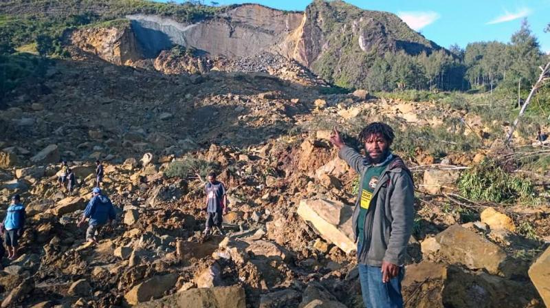 Over 100 feared dead by a landslide in Papua New Guinea Over 100 feared dead by a landslide in Papua New Guinea