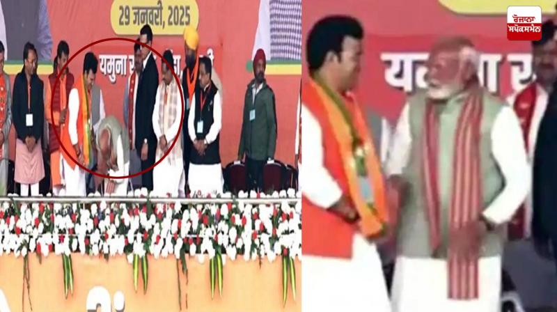 PM Modi touched the feet of BJP candidate Ravinder Singh Negi three times on the stage PM Modi touched the feet of BJP candidate Ravinder Singh Negi three times on the stage