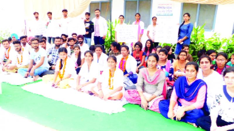 College students sitting on hunger strike during dharna