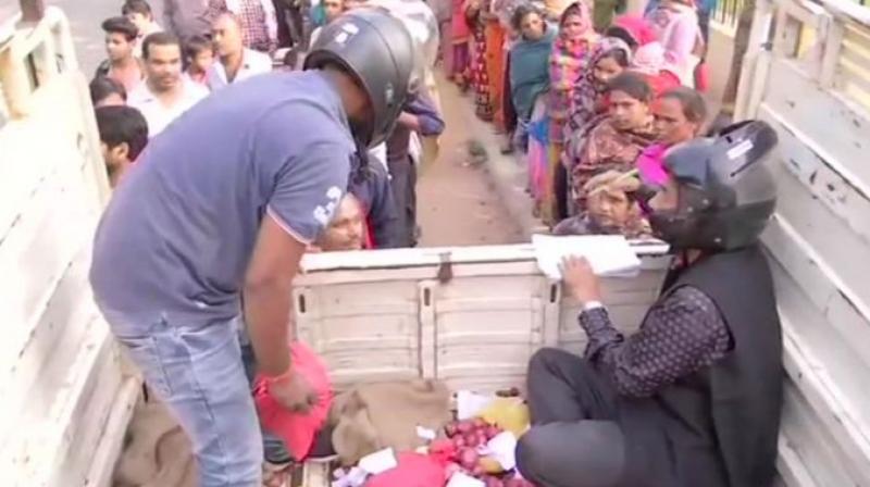 staffs of biscomaun sells onion after wearing helmet