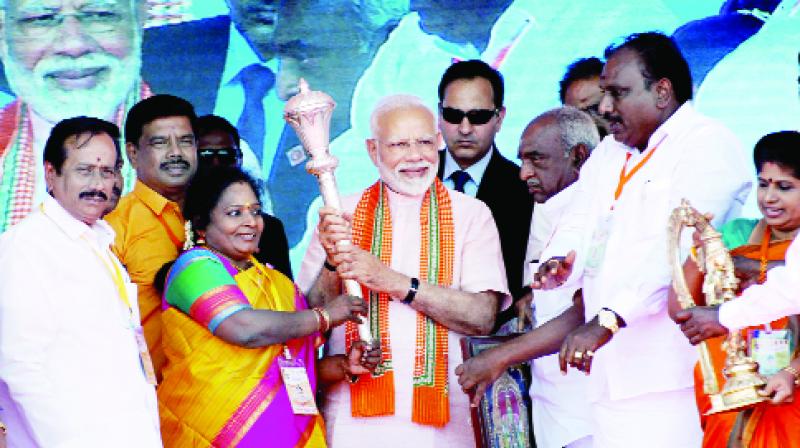 Prime Minister Narendra Modi with party leaders during a BJP rally at Madurai