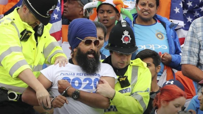 India and new zealand sikh spectator reacts as he is taken away by cops