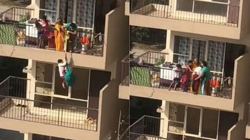 Mother hangs son from 10th floor balcony by saree Mother hangs son from 10th floor balcony by saree