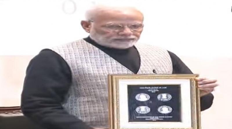 PM Modi releases Rs 100 coin PM Modi releases Rs 100 coin