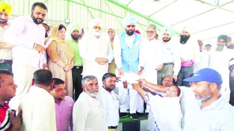 Distributing The Check To Panchayat Members By Rana Sodhi