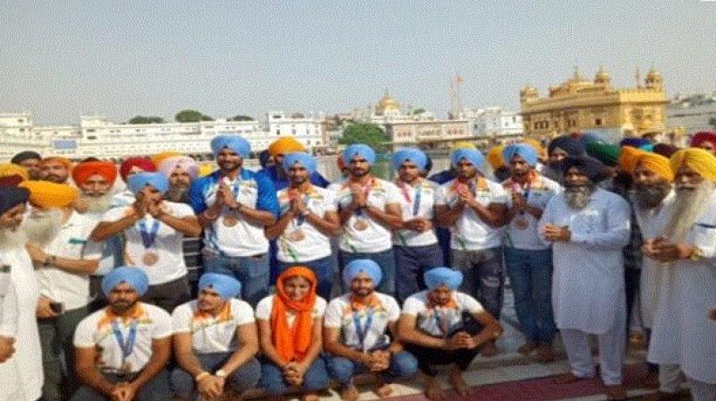 Hockey Players at Golden Temple Amritsar Hockey Players at Golden Temple Amritsar