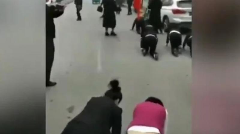 Employees forced to crawl Employees forced to crawl