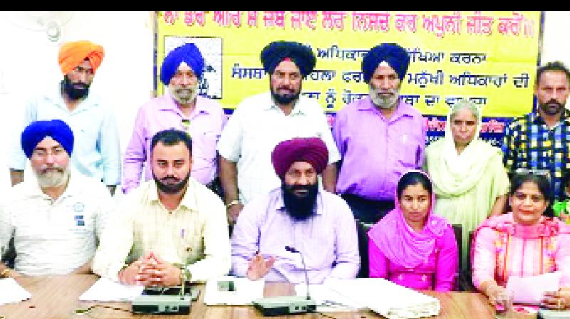 Satnam Singh Dhaliwal addressing a press conference