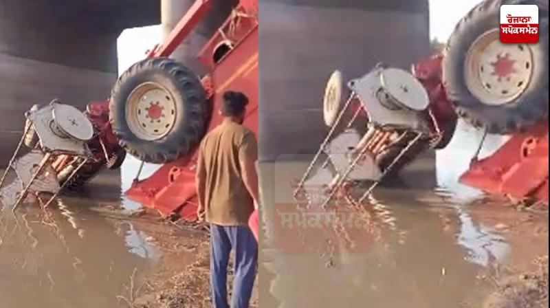overturned combine in the canal overturned combine in the canal