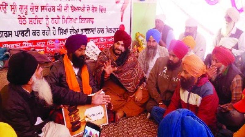 Navjot sidhu With families of the deceased and Ajit Singh at Behbal Kalan Dharna 