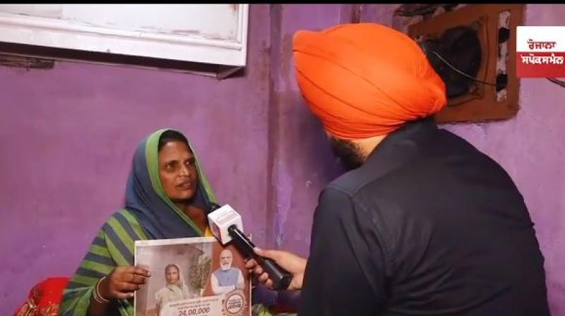 woman with PM Modi's advertisement woman with PM Modi's advertisement