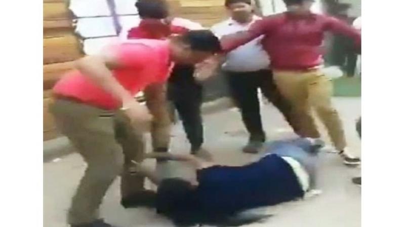 Noida woman dragged by hair, thrashed with sticks for demanding salary Noida woman dragged by hair, thrashed with sticks for demanding salary