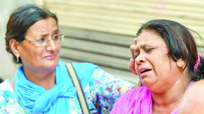 Lamenting family's relative women Lamenting family's relative women