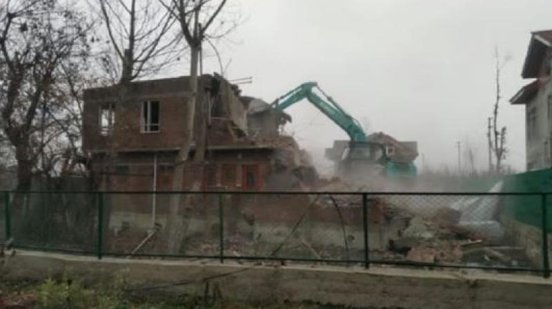 JeM militant commander Ashiq Nengroo's house demolished in J&K's Pulwama JeM militant commander Ashiq Nengroo's house demolished in J&K's Pulwama