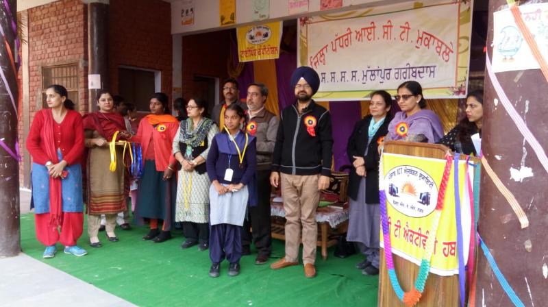 Sandeep Nagar Dr. Jarnail Singh Kaleke and other teachers honoring the winner girl