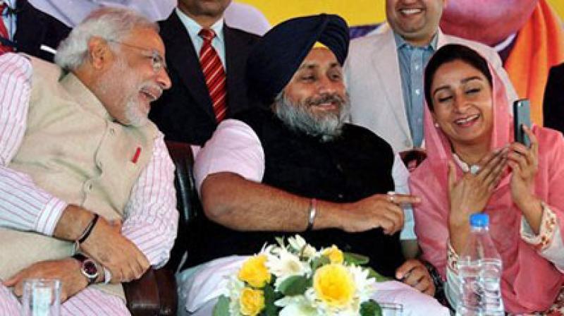 Narendra Modi, Sukhbir Badal, Harsimrat Badal (File Photo) Narendra Modi, Sukhbir Badal, Harsimrat Badal (File Photo)