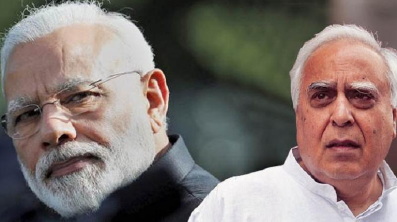 PM Modi and Kapil Sibal PM Modi and Kapil Sibal