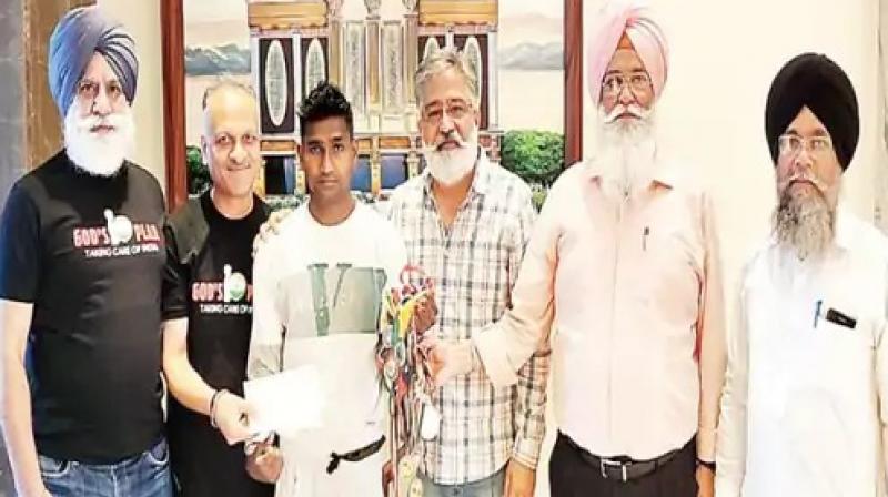 God's Plan Foundation members with boxer Manoj God's Plan Foundation members with boxer Manoj