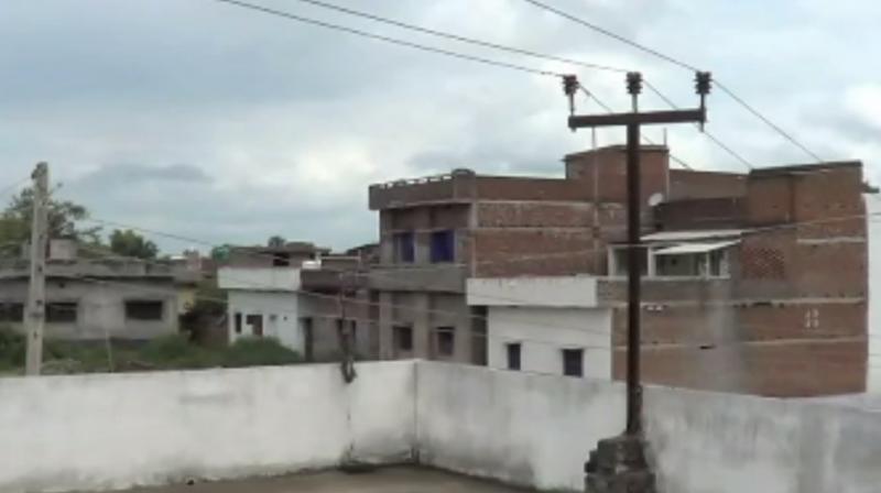 High voltage electric wire on head of roof in Gaya