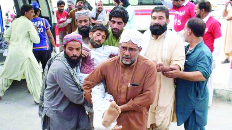 Relief workers taking the injured Peoples in Bomb Blast