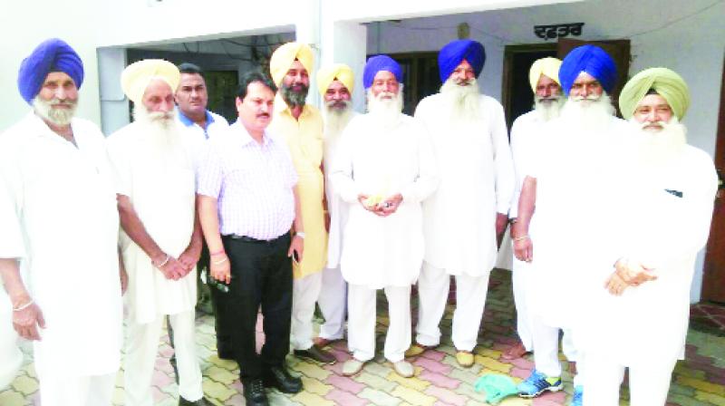 Tehsildar Arvind Salwan While giving charge of the management of Gurdwara Sahib to Sulkhan Singh Sekha Tehsildar Arvind Salwan While giving charge of the management of Gurdwara Sahib to Sulkhan Singh Sekha