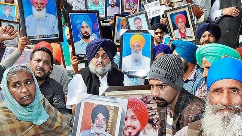 SAD president Sukhbir Singh Badal with the kin of farmers who committed suicide, in Chandigarh SAD president Sukhbir Singh Badal with the kin of farmers who committed suicide, in Chandigarh