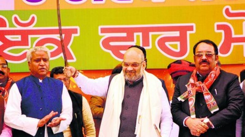 BJP national president Amit Shah and state president Shwet Malik during a rally in Amritsar