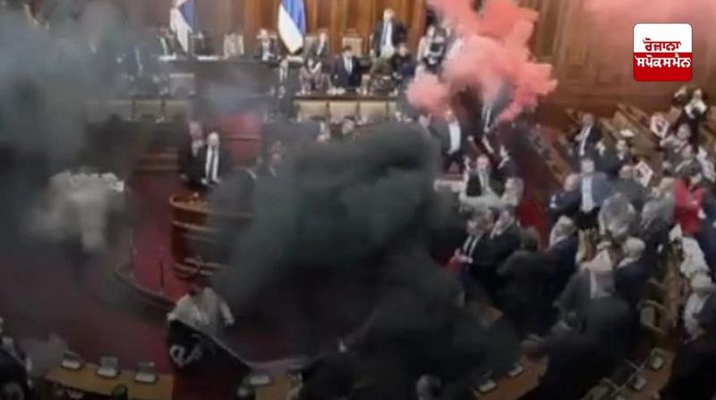 Opposition attacks Serbian parliament with smoke grenade, two injured Opposition attacks Serbian parliament with smoke grenade, two injured