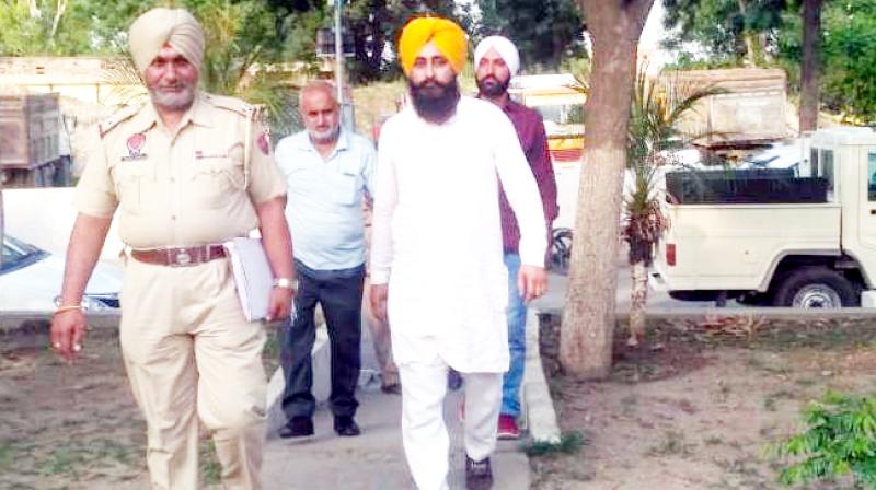 Ajvinder Singh and Bachittar Singh with Police party