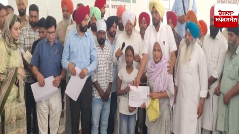 Minister Dhaliwal gave compensation cheques to the families of the deceased in the Majitha liquor scandal. Minister Dhaliwal gave compensation cheques to the families of the deceased in the Majitha liquor scandal.