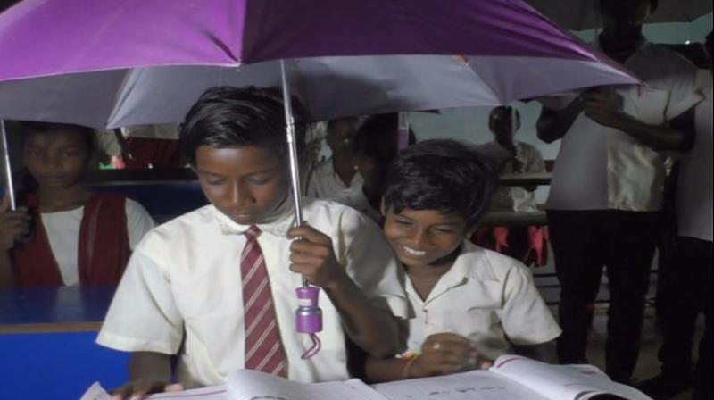 East singhbum students uses umbrella in class room of ghatshila
