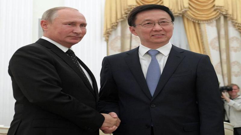Vladimir Putin and Han Zheng Vladimir Putin and Han Zheng