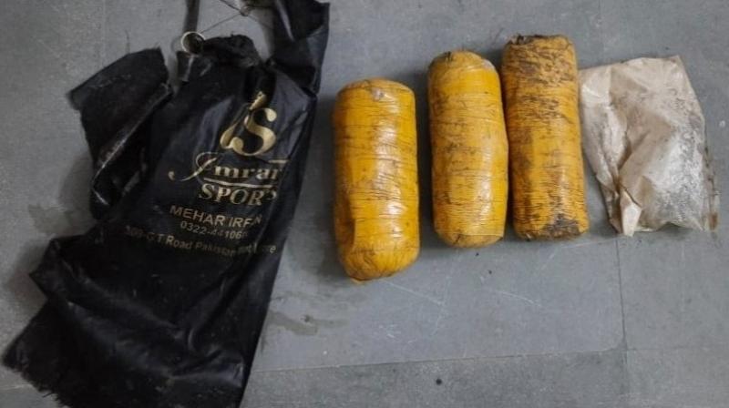 Four packets of suspected heroin recovered from field Four packets of suspected heroin recovered from field