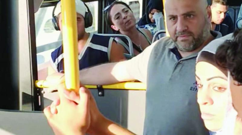 Girl taunting Muslim Woman Girl taunting Muslim Woman
